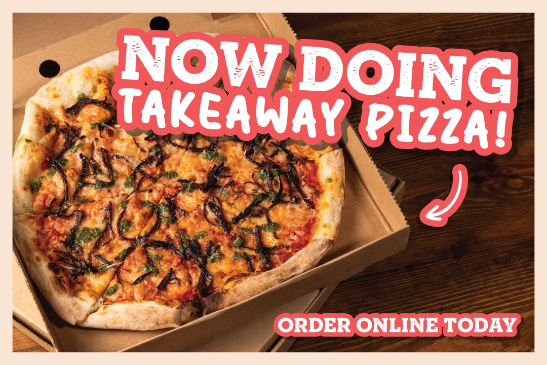 Two takeaway boxes with Pizza with hand grabbing a slice from the left takeaway box